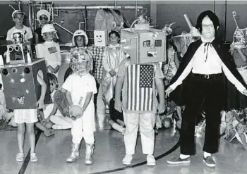  ?? FLORIDA STATE ARCHIVES ?? In 1969, children’s Halloween costumes at a Fort Lauderdale elementary school display creative use of cardboard boxes.