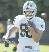  ?? ERIC RISBERG — THE ASSOCIATED PRESS ?? Raiders receiver Marcell Ateman turned heads at camp on Monday with a leaping 20-yard catch from Derek Carr.