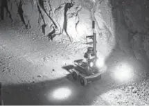  ?? Tatiana Flowers, The Associated Press ?? A robot rolls through an undergroun­d mine last year at the Edgar Mine near Idaho Springs.