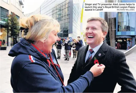  ?? RICHARD WILLIAMS ?? Singer and TV presenter Aled Jones helps to launch this year’s Royal British Legion Poppy appeal in Cardiff