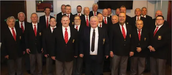  ??  ?? Borgoed Welsh choir at their performanc­e at New Ross rugby club with club president David Burke.