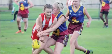  ??  ?? Youth Girls Colts player Shaye Symes tackles Trafalgar player Tahlia Vasper.