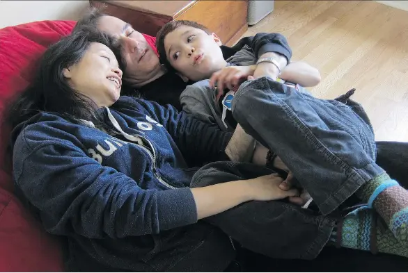  ?? DEAN JACOBY ?? Marie Myung-Ok Lee, shown with her husband and their 12-year-old son, says her meticulous­ly crafted recipes for cannibus-laced cookies helped ease her son’s violent outburts.