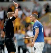  ?? AP ?? Referee Craig Pawson shows a red card to Everton defender Phil Jagielka.