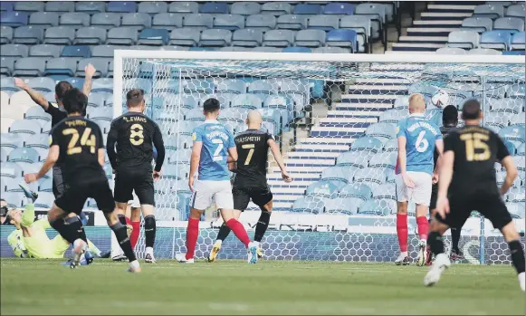  ?? Pictures: PinPeP ?? HAMMER BLOW Tom James’ spectacula­r free kick hits the back of Pompey’s net, giving Wigan Athletic a two-goal lead at Fratton Park on Saturday.