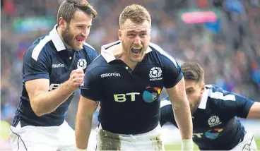  ??  ?? ■ Stuart Hogg celebrates Scotland’s opening try against Ireland at Murrayfiel­d.