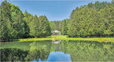  ??  ?? The four-bedroom stucco home is secluded on a 15-acre property.