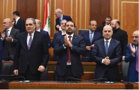  ?? (Reuters) ?? LEBANON’S OUTGOING Prime Minister Sa’ad Hariri (center) joins the newly elected parliament convening for the first time in Beirut, yesterday.