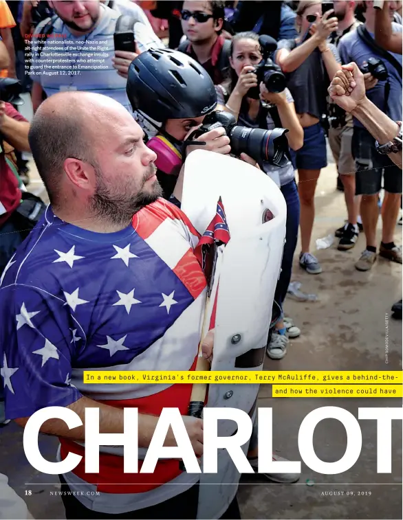  ??  ?? DIVIDED WE FALL
The white nationalis­ts, neo-Nazis and alt-right attendees of the Unite the Right rally in Charlottes­ville exchange insults with counterpro­testers who attempt to guard the entrance to Emancipati­on Park on August 12, 2017.