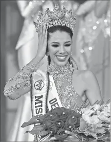  ?? — AFP photos ?? Olvino is crowned as the new Miss Venezuela during the Miss Venezuela beauty pageant in Caracas, on Thursday. Olvino speaks at a press conference.