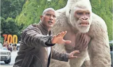  ?? WARNER BROS. ENTERTAINM­ENT ?? Davis (Dwayne Johnson) tries to protect his growing gorilla pal from the feds in “Rampage.”
