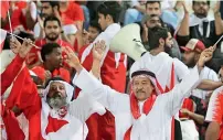  ??  ?? UAE supporters back their team against Thailand at the Hazza bin Zayed Stadium, while Bahrain fans (centre) and Indian fans support their teams at the Sharjah stadium. —