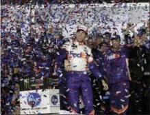  ?? JOHN RAOUX — THE ASSOCIATED PRESS ?? Denny Hamlin celebrates in Victory Lane after winning the NASCAR Daytona 500 auto race at Daytona Internatio­nal Speedway Sunday in Daytona Beach, Fla.