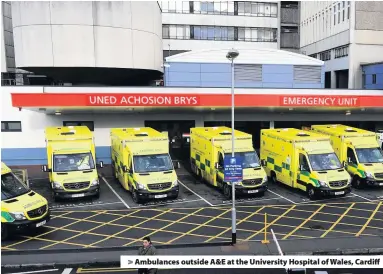  ??  ?? &gt; Ambulances outside A&amp;E at the University Hospital of Wales, Cardiff