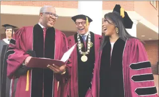  ?? Bo Emerson / Associated Press ?? Robert F. Smith, left, laughs with David Thomas and actress Angela Bassett at Morehouse College on Sunday in Atlanta.