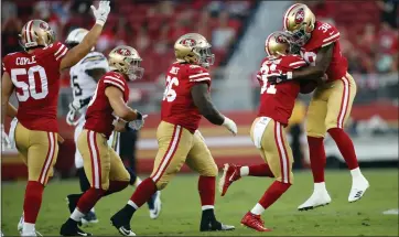  ?? JOHN HEFTI — ASSOCIATED PRESS ?? Cornerback Asa Jackson, second from right, helped his cause to stick with the 49ers with a first-half intercepti­on against the Chargers. The teams must get down to 53 players by Saturday afternoon.