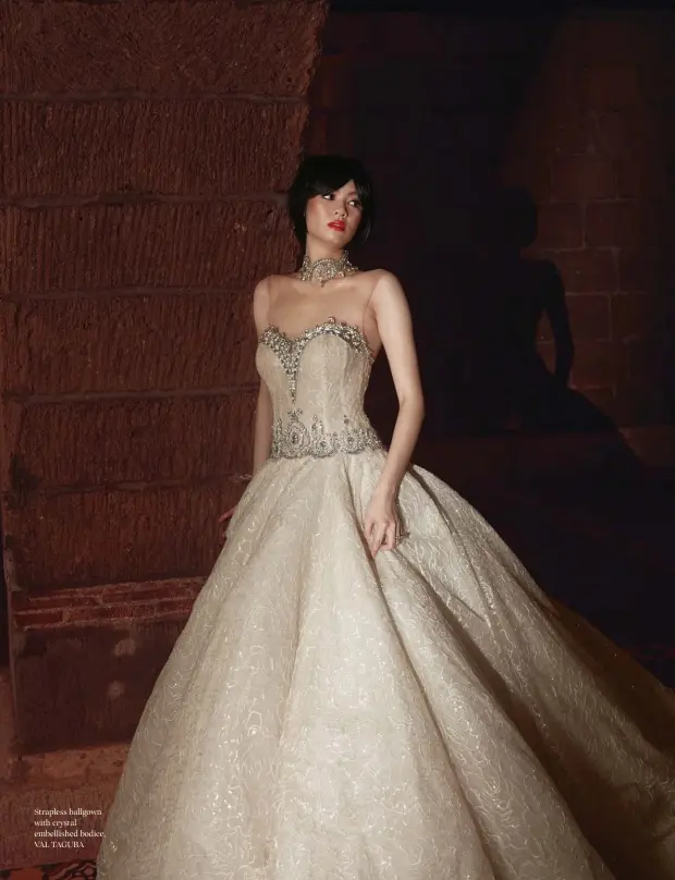  ??  ?? Strapless ballgown with crystal embellishe­d bodice, VAL TAGUBA