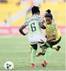  ??  ?? JERMAINE Seoposenwe of South Africa is fouled by Josephine Chiwendu Chukwunony­e of Nigeria during the African Women’s Cup of Nations final. |