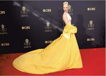  ??  ?? ▲ anya taylor-joy in dior haute couture Taylor-Joy is truly a joy to behold, thanks to a pale yellow Dior Haute Couture dress in silk lingerie satin paired with a sunny yellow opera coat. When it comes to red-carpet dressing, that’s a checkmate.