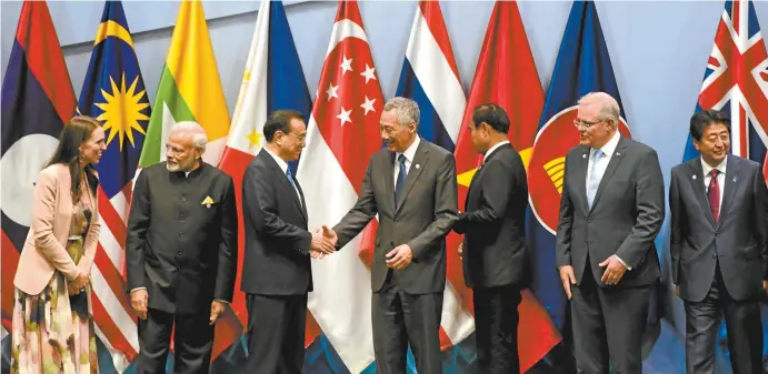  ??  ?? A group photo at an economic forum this week during the ASEAN Summit in Singapore, with, from left, Jacinda Ardern, Narendra Modi, Li Keqiang,Lee Hsien Loong, Prayut Chan-o-cha, Scott Morrison and Shinzō Abe.