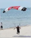  ?? DAVE JOHNSON THE WELLAND TRIBUNE ?? A skydiver lands at Sherkston Shore's Wyldewood Beach Thursday afternoon.