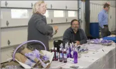  ?? SUBMITTED PHOTO ?? Scott, right, and Anna Larsen, left, of Windy Hill Farm, specialize in English Lavender which then is used in their products. They also manage a 50-tree orchard and harvest seasonal fresh produce for their farm stand. This photo shows the Windy Hill Farm display at the 2018 Agricultur­al Summit.