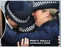  ?? ?? PAIN PC Milburn is comforted in 2006