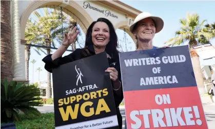  ?? ?? Fran Drescher, actor and president of Sag-Aftra, and Meredith Stiehm, president of the Writers Guild of America West, pose at a rally by striking writers outside Paramount Pictures studio in Los Angeles last month. Photograph: Chris Pizzello/AP