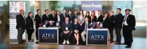  ?? CONTRIBUTE­D PHOTO ?? SmarTrade coaches with (front) ATFX Chief Executive Officer (CEO) for Southeast Asia Jeff Hsu, SmarTrade President and CEO Joyce Mayo and ATFX Vice President for Southeast Asia Norris Li.