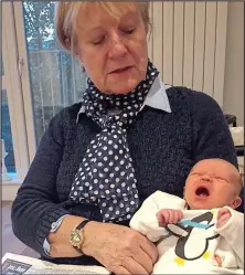  ??  ?? Balanced formula: Carol Dighton with five-day-old Leo, the baby of one her breastfeed­ing clients