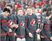  ?? CP PHOTO ?? Canada celebrates their victory against Sweden following the Hlinka Gretzky Cup gold medal game in Edmonton on Saturday. Canada won 6-2.