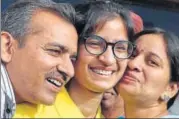  ?? PTI PHOTO ?? ▪ AIIMS topper Eliza Bansal celebrates her success with her parents in Patiala, on Monday.