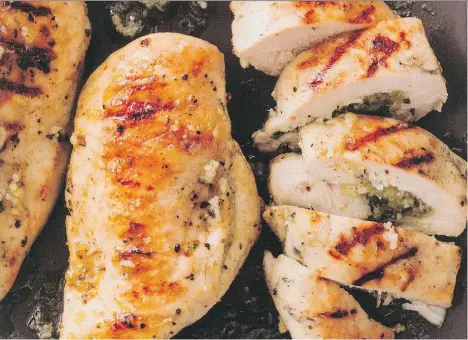  ??  ?? Barbecued chicken breasts are stuffed with a basil and cheese mixture, with the added zing of lemon juice and zest.