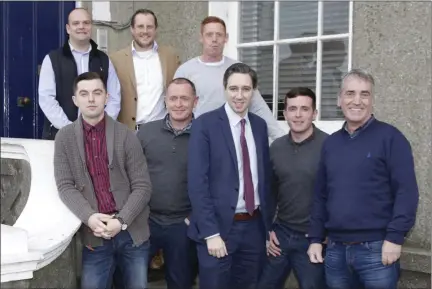  ??  ?? Minister Simon Harris and Phil Thompson of Tiglin with Carraig Eden residents Cian O’Shea, Christophe­r O’Reilly, Denis Ferry, John Mahon, Jonathan Golding and John Doyle.