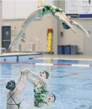  ?? MICHELLE BERG/The StarPhoeni­x ?? Olympian Elise Marcotte works with Saskatchew­an’s Canada Winter Games synchroniz­ed swim team at the Shaw Centre Sunday in Saskatoon.