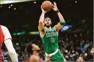  ?? Steven Senne / Associated Press ?? Forward Jayson Tatum leads the Celtics in scoring at 26.9 ppg.