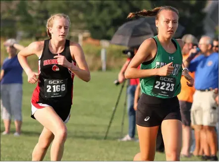  ?? RANDY MEYERS — FOR THE MORNING JOURNAL ?? Columbia’s Madeleine Finton and Brookside’s Madison Palmer are nearly even during the first half of the girl’s race at the Open Door Invitation­al held at Lorain County Community College on Sept. 14.