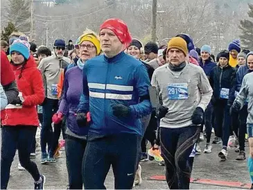  ?? Sandra Diamond Fox/Hearst Connecticu­t Media ?? Nearly 600 runners braved the cold temperatur­es Sunday afternoon to run the 38th annual Lake Waramaug Polar Bear Run in Kent.