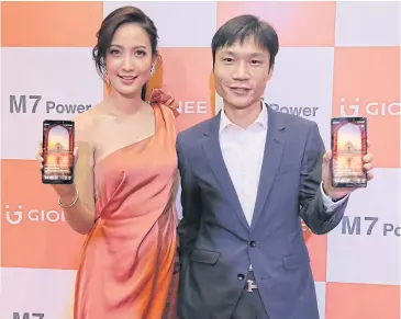  ??  ?? There is still room for Gionee to expand its footprint in the crowded Thai market, says Mr Zheng, seen here with brand ambassador actress Natapohn Taew Tameeruks.