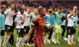  ?? Photograph: Andrew Milligan/PA ?? Aberdeen's Jonny Hayes leaves the field as Häcken players celebrate their aggregate win.