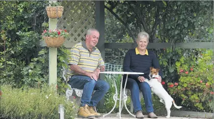  ?? Picture: PAUL CARRACHER ?? WORTHWHILE: Fred and Robyn Simpson, with dog Paddy, will open their garden for Wimmera Hospice Care Auxiliary’s Gardens of Haven event later this month.