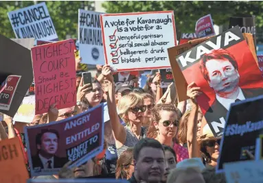  ??  ?? Demonstrat­ors protest Supreme Court nominee Brett Kavanaugh on Thursday in Washington.
