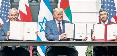  ??  ?? PROGRESS: President Trump joins Israeli Prime Minister Benjamin Netanyahu and UAE Foreign Minister Abdullah bin Zayed at the White House to sign the Abraham Accords to normalize relations between Israel and the UAE.