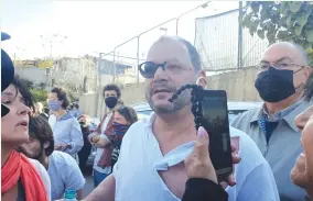  ?? (Courtesy) ?? JOINT LIST MK Ofer Cassif speaks to reporters after being beaten by police during a demonstrat­ion in the Arab Jerusalem neighborho­od of Sheikh Jarrah on Friday.