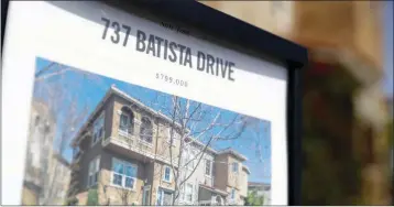  ?? ASSOCIATED PRESS ?? IN THIS TUESDAY, MARCH 6 photo, a flyer lists the price of a home for sale in San Jose, Calif.