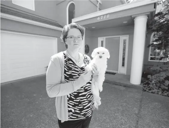  ??  ?? Anna Echols (with her dog Toby) lives in Central Saanich and can’t find a doctor.