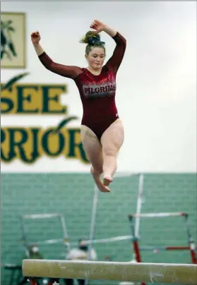  ?? PILOT PHOTO/RUDY MARQUEZ ?? Plymouth’s Tessa Hutchinson performs on the beam at sectionals Saturday. The PHS sophomore placed third in the event to advance to regionals.
