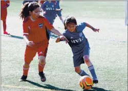  ?? COURTESY OF THE KIM FAMILY ?? Taylor Kim, 8, of San Jose, has moved to Phoenix with her older sister Nicole, 13, and father, Paul Kim, to play soccer. Taylor, shown here, is playing for a team of under-10s because of her advanced skill level.