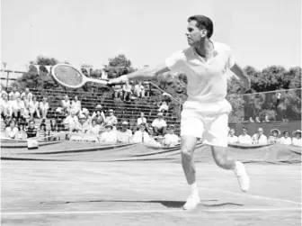  ?? AP FILE ?? Dick Savitt hits a shot during a Davis Cup match against Fumiteru Nakano of Japan in Louisville, Kentucky, in 1951. Mr. Savitt, who won the Australian Open and Wimbledon in 1951 shortly before walking away from a tennis career at age 25, passed away at home in New York on Friday. He was 95.