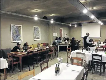  ?? PHOTOS:
CHRIS PRETORIUS ?? TUCKING IN: The indoor dining area of the Canteen at Arts on Main in the Joburg CBD where the decor matches its name, but the prices for food and drinks don ’ t